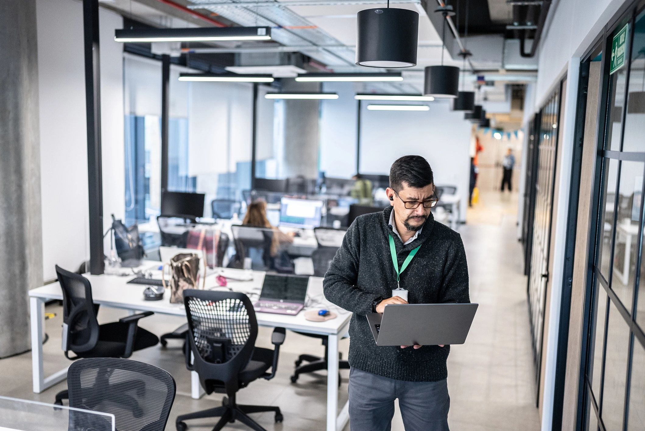 IT support professional working on a laptop
