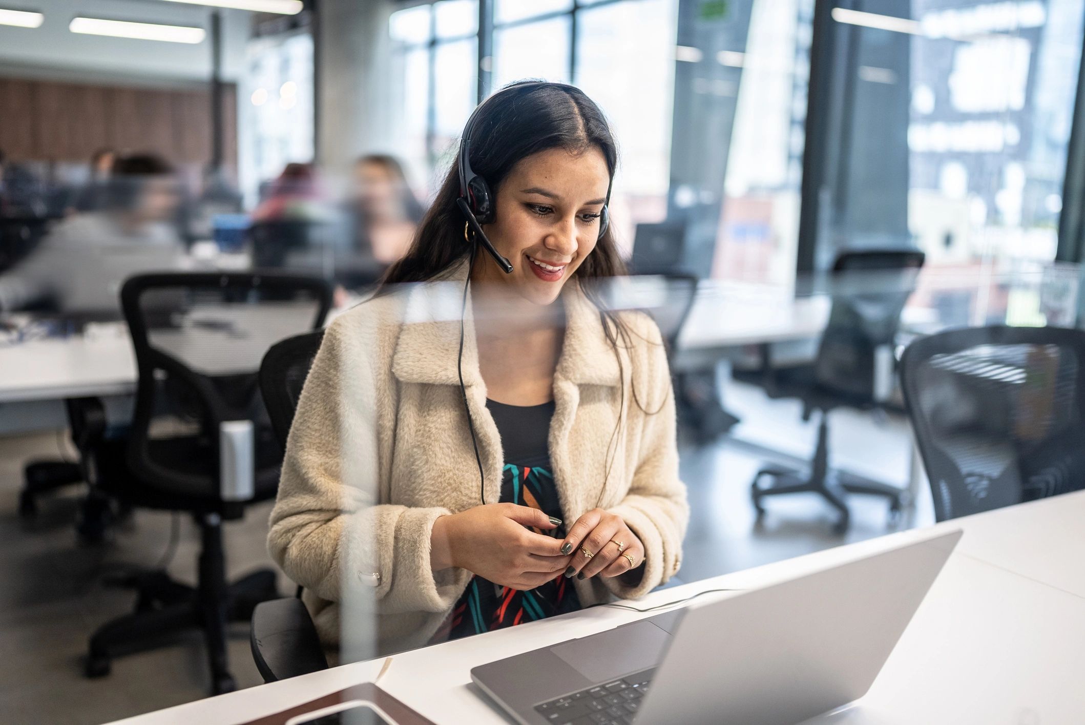 IT support professional assisting customers at a helpdesk