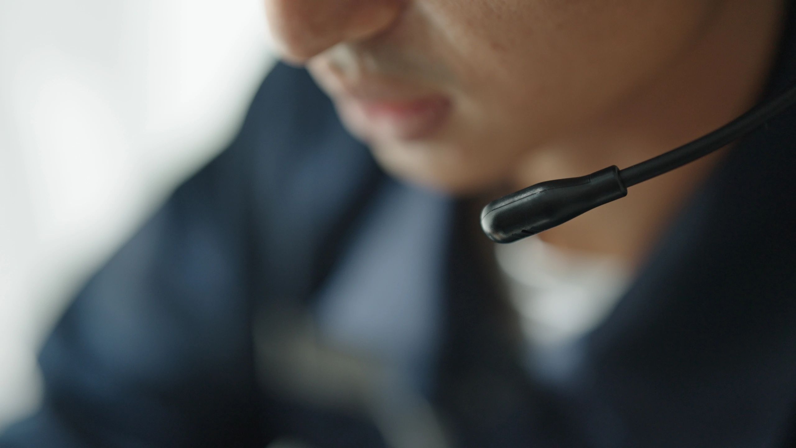 Help desk technician on headset providing remote IT support